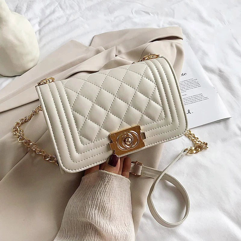 white handbag with gold detail