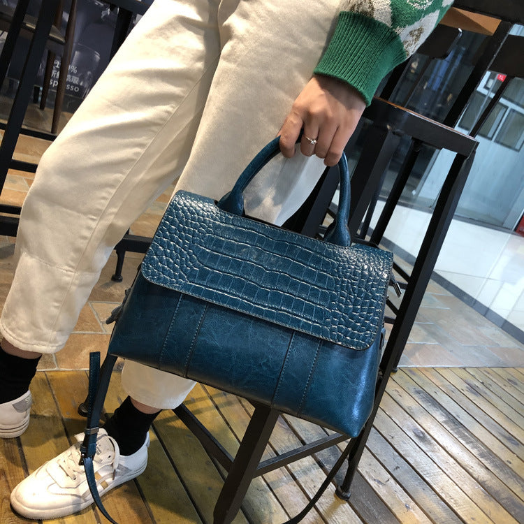 blue leather tote handbag