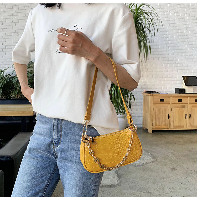 yellow baguette bag with gold chain detail