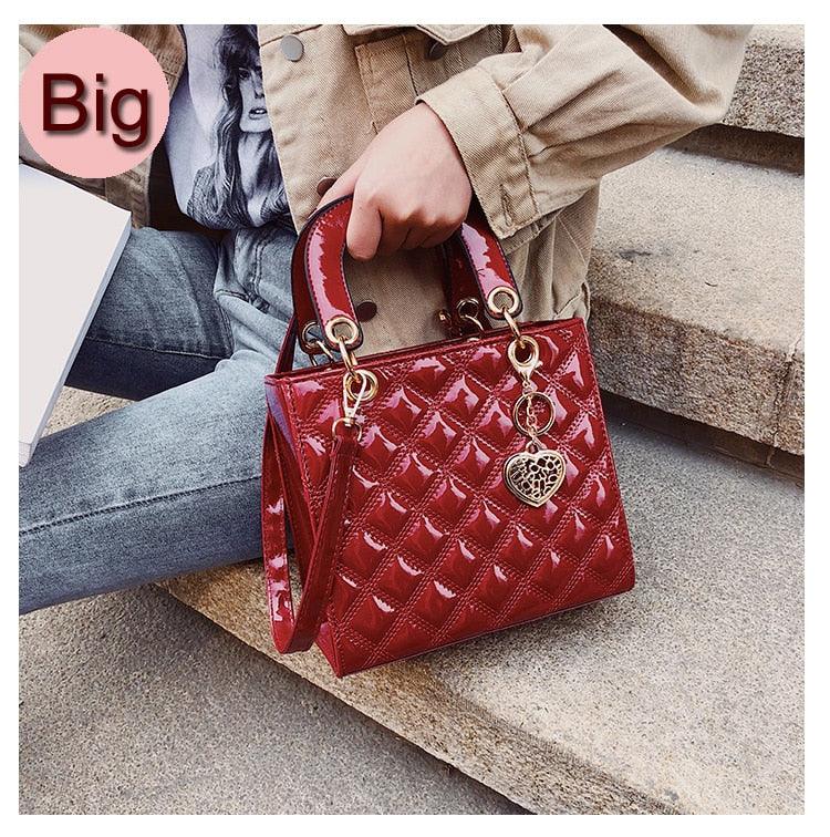 red tote handbag with goldheart bag charm