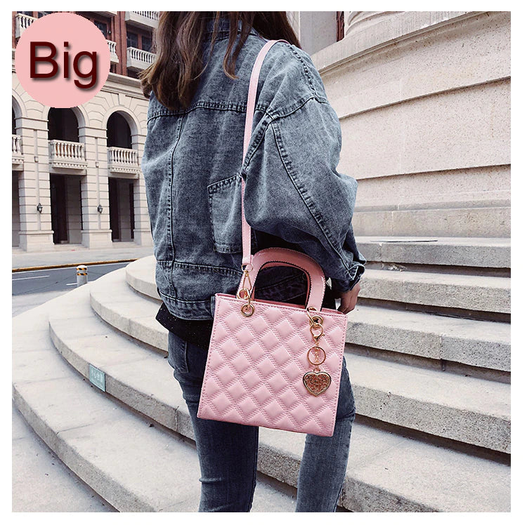 pink tote bag with bag charm