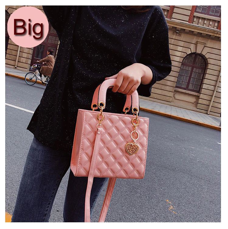 pink tote handbag with bag charm