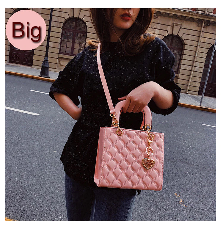 pink handbag with bag charm