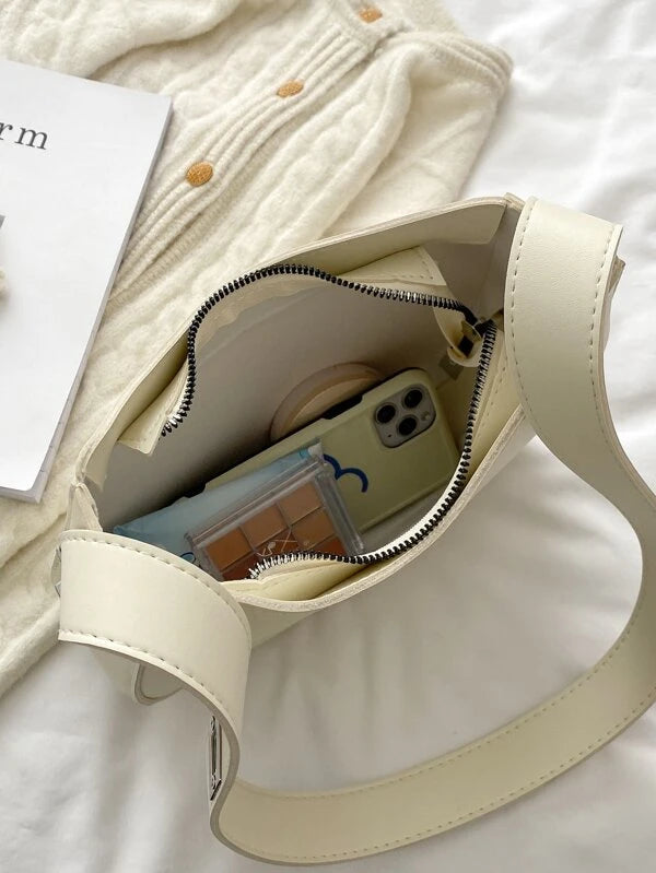 cream shoulder bag inside view