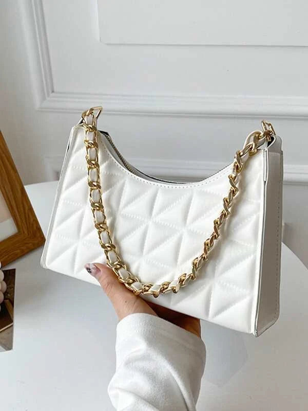 white textured handbag