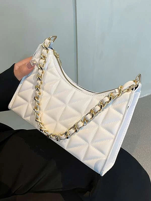 white bag with leather threaded chain strap