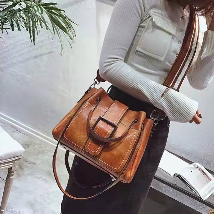 brown bag with thick strap